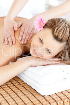 Blissful young woman enjoying a back massage