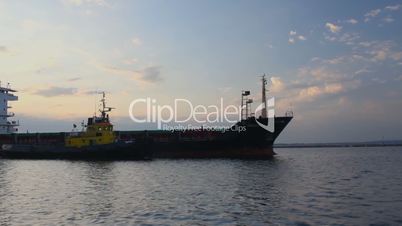 Cargo ship leaves port (Full HD)