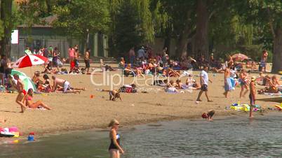 people on beach, warm summer day, Canada