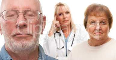 Concerned Senior Couple and Female Doctor Behind