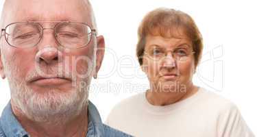 Concerned Senior Couple on White