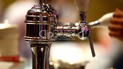 Pour beer in bar