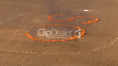 flaming letters: C S in dirt