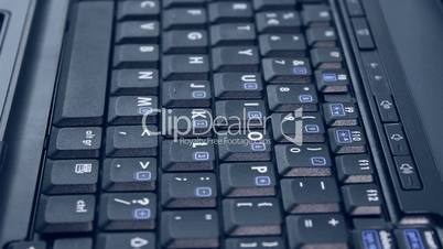 Typing perspective on black laptop keyboard