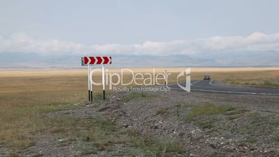 Car driving on mountain road in Russian Altai