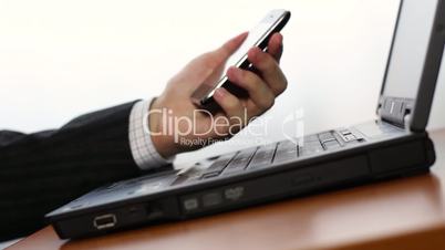 Shopping online using cell phone and laptop
