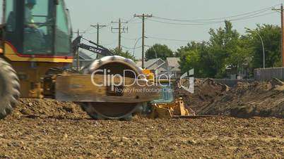construction backhoe and bulldozers, long lens