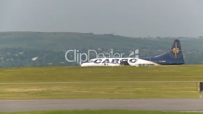 aircraft, Convair freighter taxi with passenger jet passing in foreground