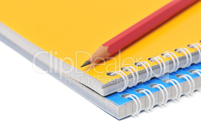 Notebook and pencil isolated on a white background