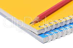 Notebook and pencil isolated on a white background
