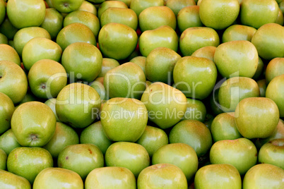 Green apples on a market stall