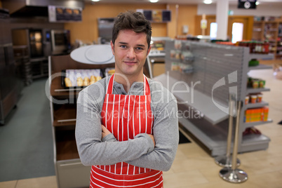 Assertive cook smiling at the camera