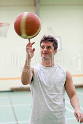 Talented man playing basketball