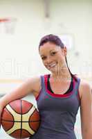 woman practicing basketball