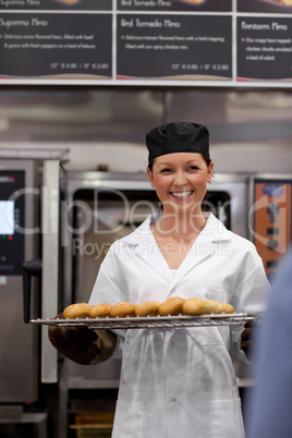 young baker with baguettes