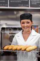 young baker with baguettes