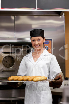 young baker with baguettes