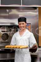 young baker with baguettes