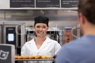 young baker with baguettes