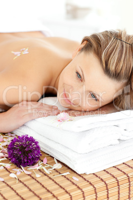 woman lying on a massage table