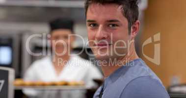 Handsome male customer in a bakery