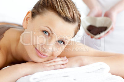 woman lying on a massage table
