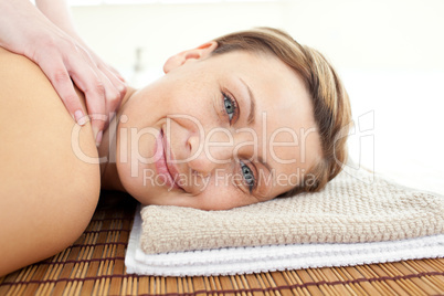 Portrait of a relaxed woman lying on a massage table