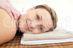 Portrait of a relaxed woman lying on a massage table