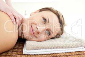 Portrait of an attractive woman lying on a massage table