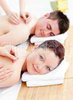 Delighted caucasian couple receiving a back massage