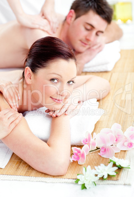 Relaxed young couple receiving a back massage