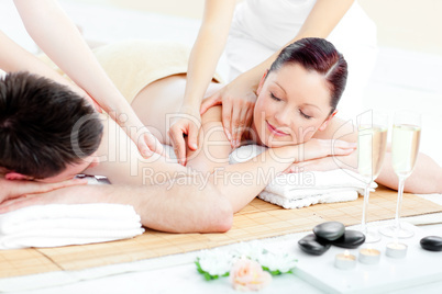 Loving young couple enjoying a back massage