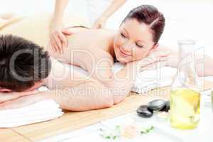 Caucasian young couple receiving a back massage