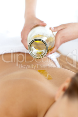 Relaxed blond woman having a massage with oil