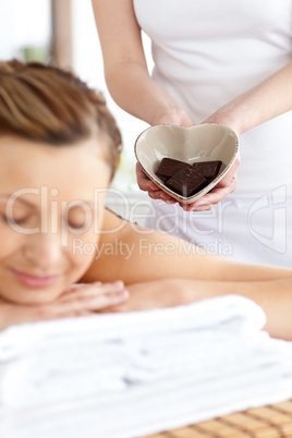 Bright woman lying on a massage table