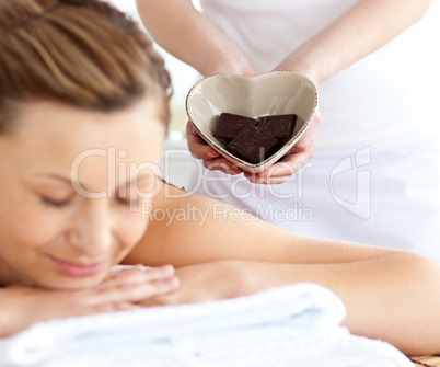 Relaxed woman lying on a massage table