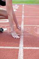 Close-up of a woman waiting in starting block