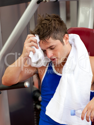 Tired man using a bench press