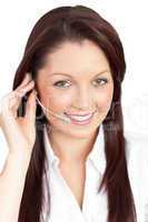 Merry young businesswoman wearing headphones