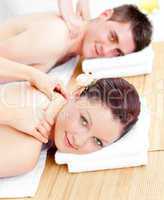 Relaxed young couple receiving a back massage