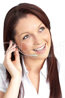 Cheerful young businesswoman with earpiece