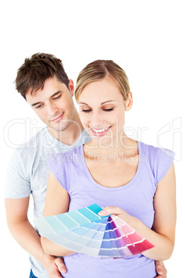 Enamored couple choosing color for a room