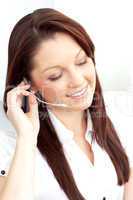 Delighted businesswoman wearing headphones