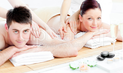 Loving young couple enjoying a back massage