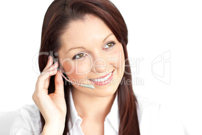 Pretty young businesswoman wearing headphones in a customer serv