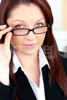 Charismatic caucasian businesswoman holding her glasses