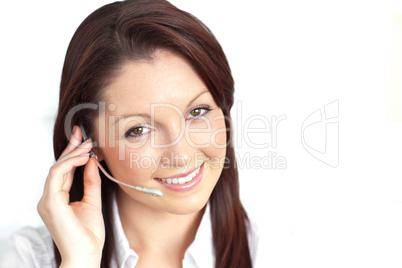 Delighted young businesswoman wearing headphones