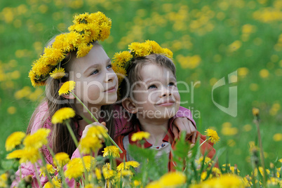Brother and sister with dandelion garlands