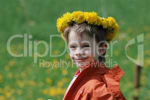 Boy in dandelion meadow.