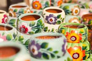 Variety of Colorfully Painted Ceramic Pots.